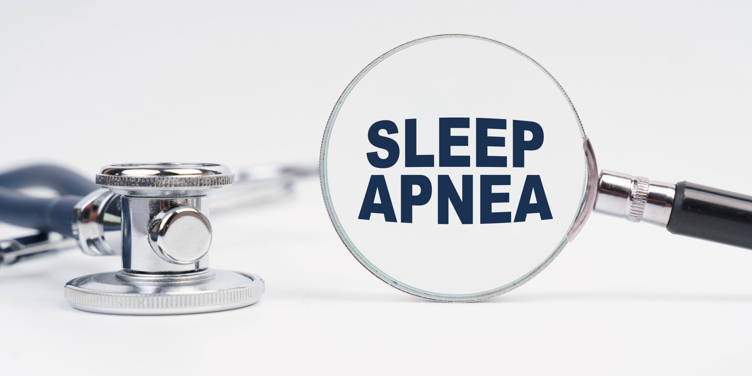 A sleep apnea clinic in New Jersey's stethoscope and magnifying glass with the inscription "Sleep Apnea."