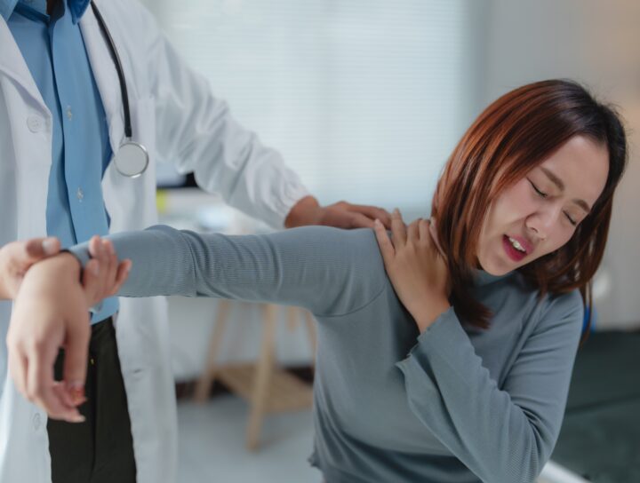 Pain management physicians, like the one assisting this female patient with her shoulder, are experts in making your daily life manageable.