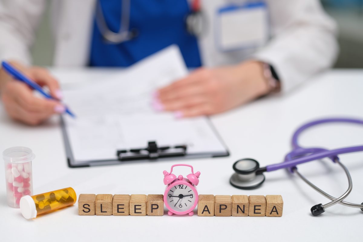 Sleep apnea spelled out in wooden blocks on a doctor's desk.