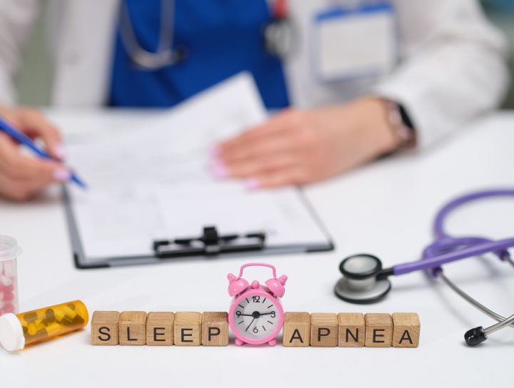 Sleep apnea spelled out in wooden blocks on a doctor's desk.
