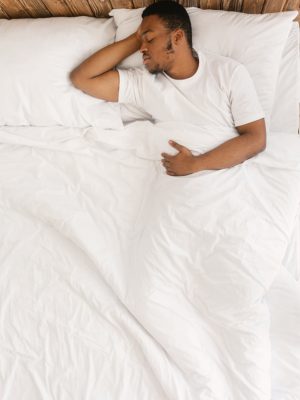 Asleep,Black,Man,Sleeping,With,Eyes,Closed,Lying,In,His