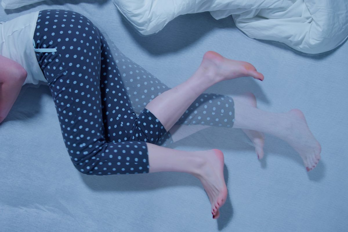 Restless legs, illustrated by this middle-age woman's legs moving in bed, is an annoying condition that can be treated.