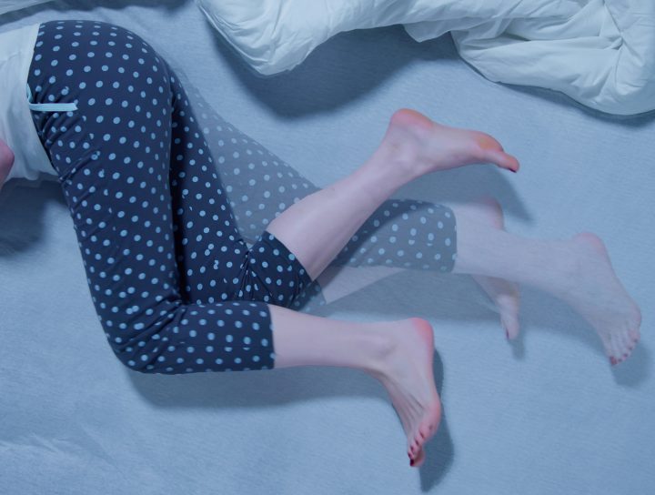 Restless legs, illustrated by this middle-age woman's legs moving in bed, is an annoying condition that can be treated.